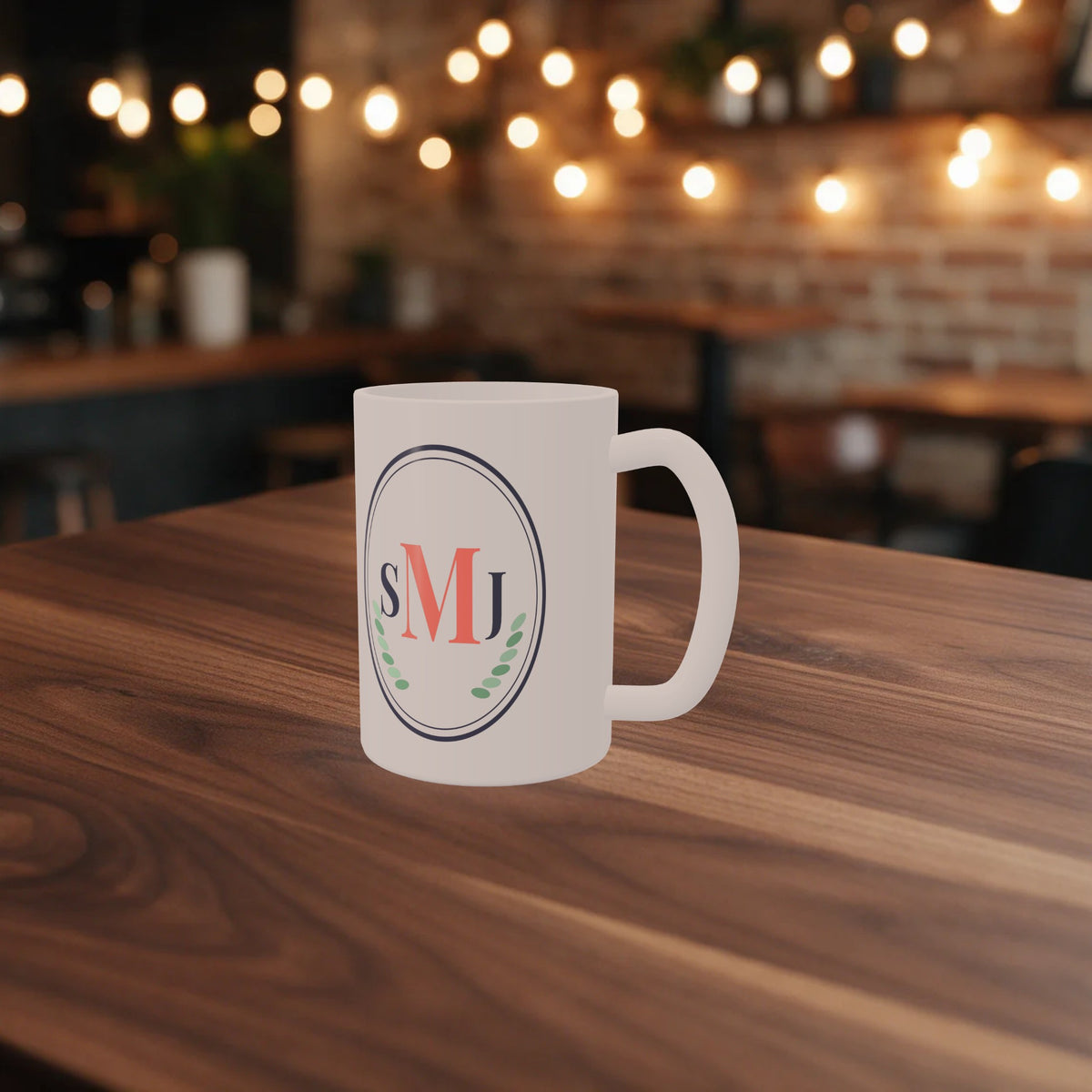 Custom 15 oz mug with a monogram design on a wooden café table