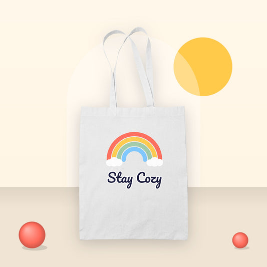 Custom printed tote bag with a Stay Cozy rainbow design
